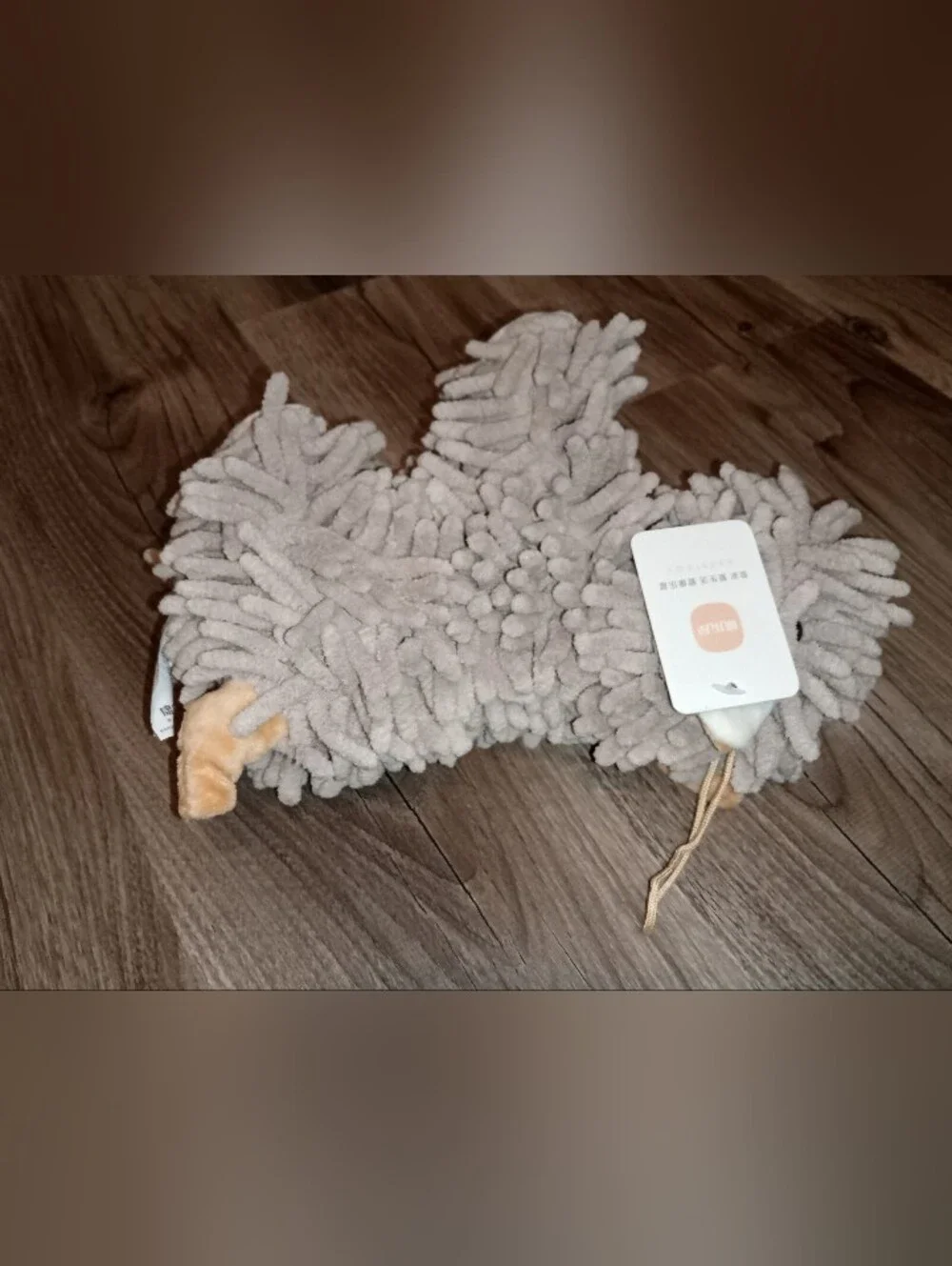 Hand towel:  Plush Mop Dog Hand Towel Light Gray and beige.
